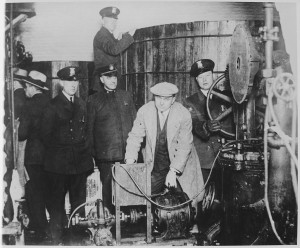 Detroit_police_inspecting_equipment_found_in_a_clandestine_underground_brewery_during_the_prohibition_era_-_NARA_-_541928